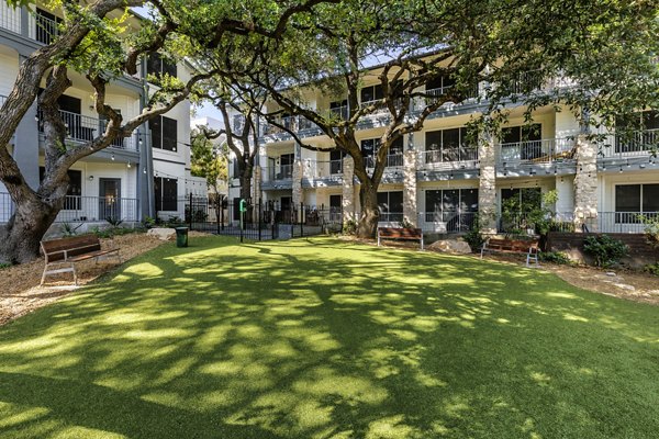 Modern dog park with agility equipment at The Lola Apartments for pet-friendly living