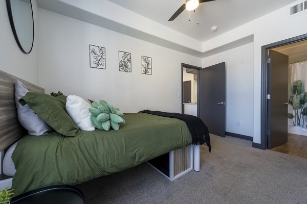 Cozy bedroom with modern decor at Gateway at Tempe Apartments: luxury living designed for comfort