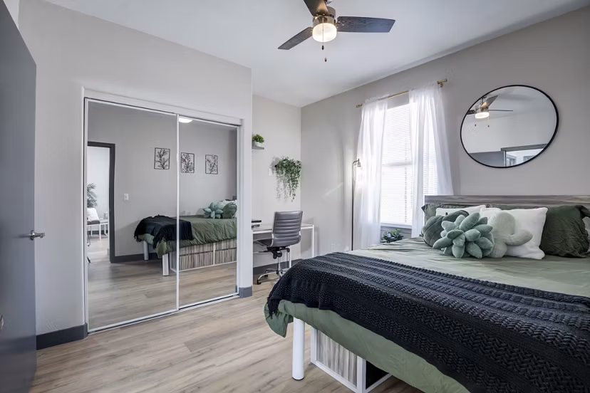 Cozy bedroom with minimalist decor at Gateway at Tempe Apartments
