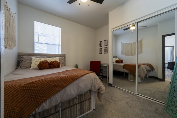 Cozy bedroom with minimalist decor at Gateway at Tempe Apartments