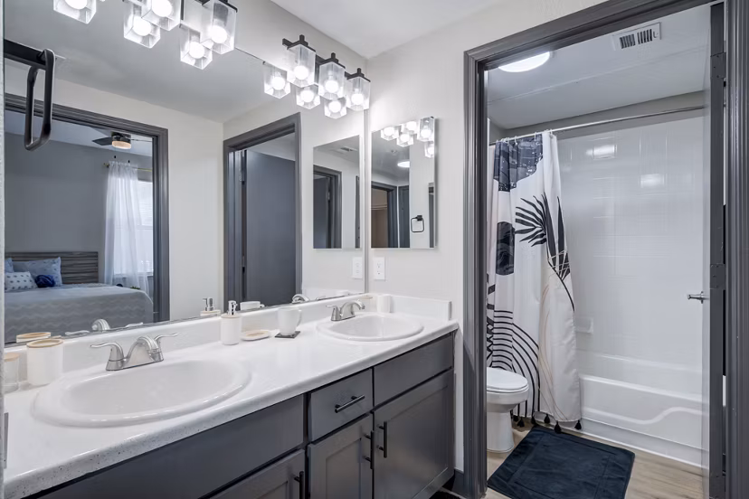 Bathroom featuring modern fixtures and double vanity in Gateway at Tempe Apartments, a Greystar luxury community