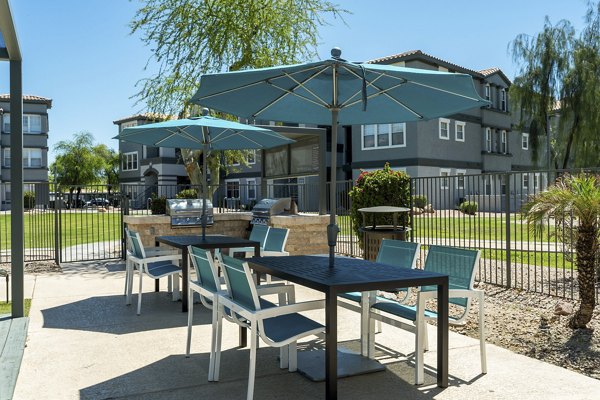 Outdoor grill area with modern seating at Gateway at Tempe Apartments, perfect for social gatherings and BBQs