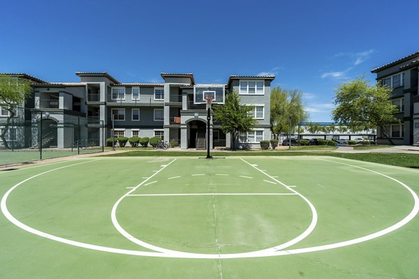 Outdoor sport court at Gateway at Tempe Apartments featuring basketball and tennis facilities for active recreation