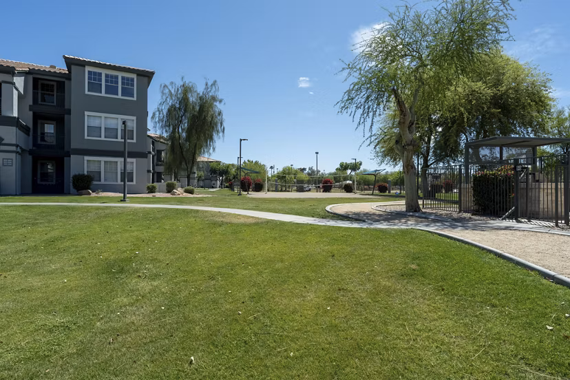 Gated courtyard with lush greenery at Gateway at Tempe Apartments, offering a serene outdoor space for relaxation