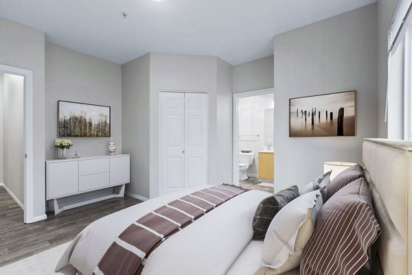 Cozy bedroom with modern decor at The Dakota Apartments