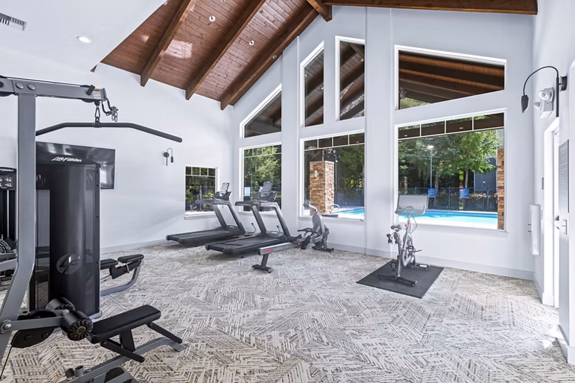 State-of-the-art fitness center at The Dakota Apartments with modern equipment for residents' workouts