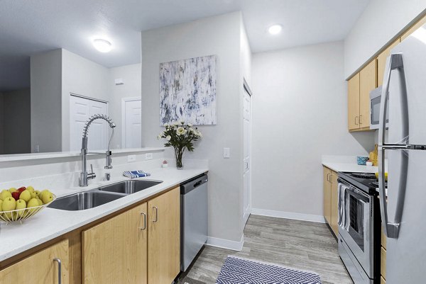 Spacious kitchen featuring modern appliances in The Dakota Apartments