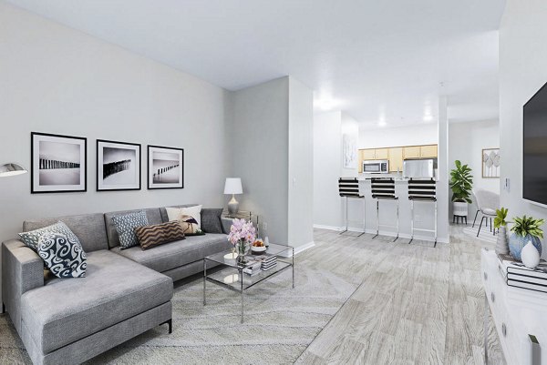 Contemporary living room with plush seating and modern decor at The Dakota Apartments