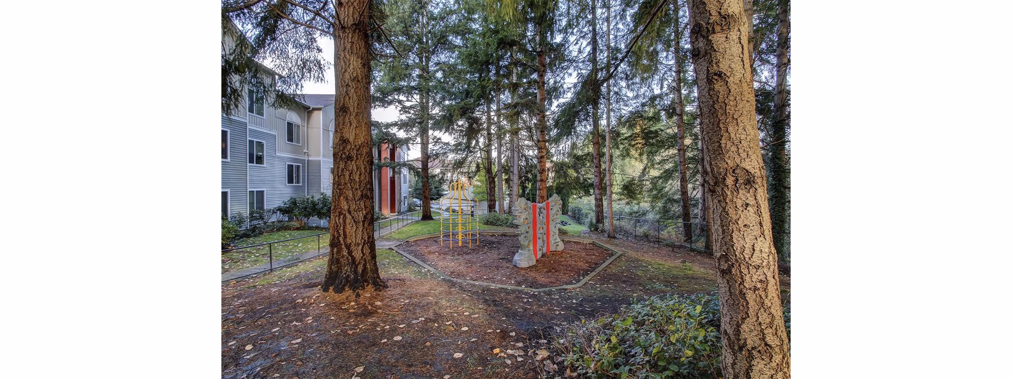 Playground at The Dakota Apartments: Spacious play area with modern equipment for family fun in luxury apartment community