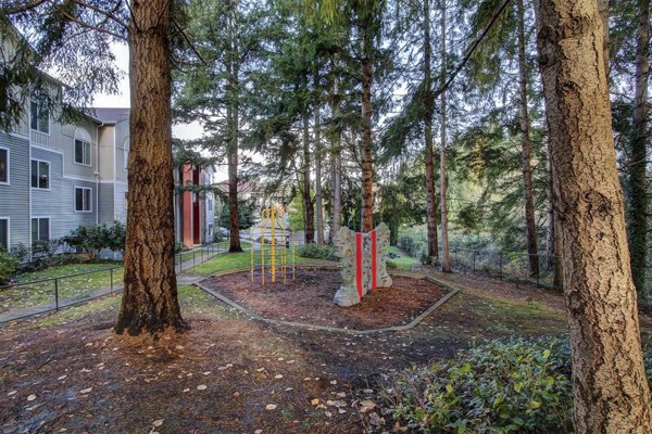 Playground at The Dakota Apartments: Spacious play area with modern equipment for family fun in luxury apartment community