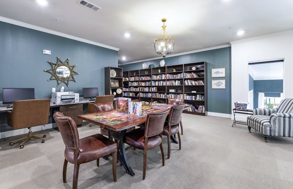clubhouse library at Ivy Point Klein Apartments