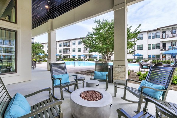 fire pit/patio at Ivy Point Klein Apartments