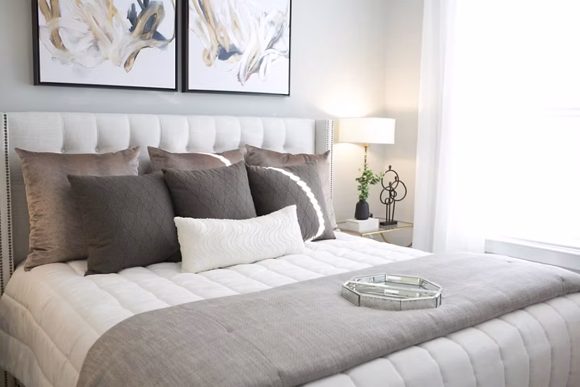 Modern bedroom with scenic views at The Peak at Nichols Plaza Apartments