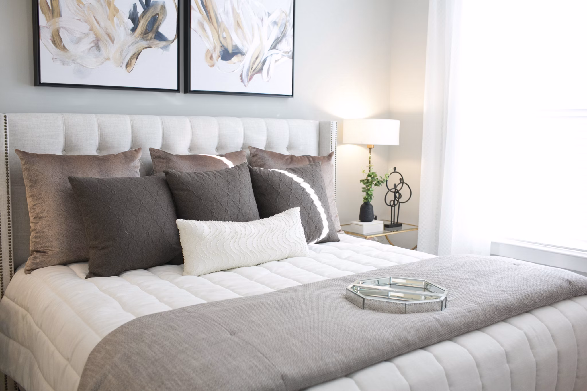 Modern bedroom with scenic views at The Peak at Nichols Plaza Apartments