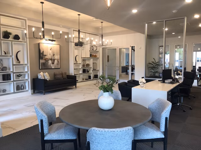 Modern clubhouse with stylish furnishings at The Peak at Nichols Plaza Apartments