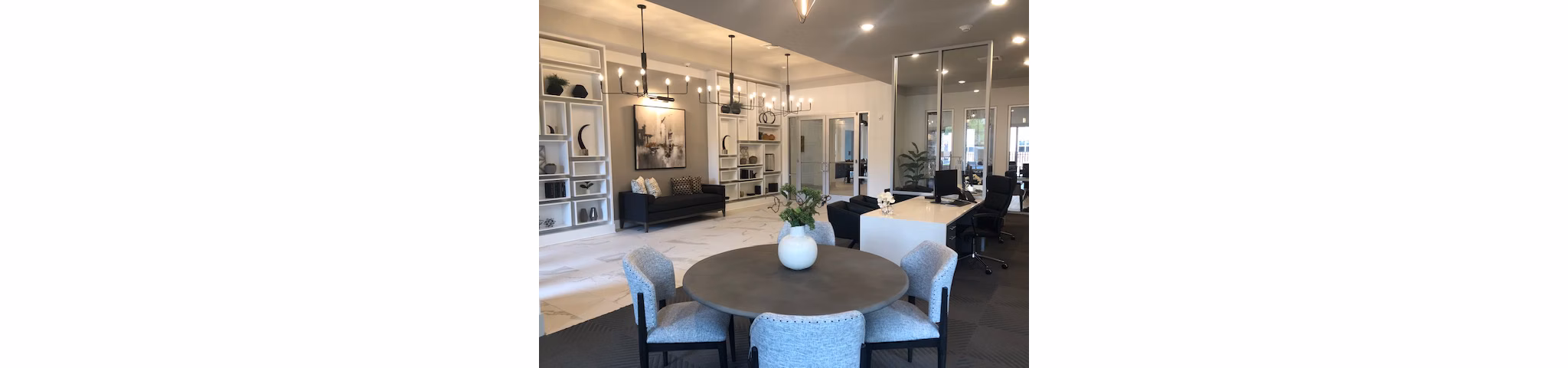 Modern clubhouse with stylish furnishings at The Peak at Nichols Plaza Apartments