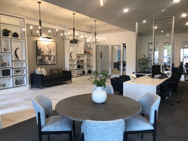 Modern clubhouse with stylish furnishings at The Peak at Nichols Plaza Apartments