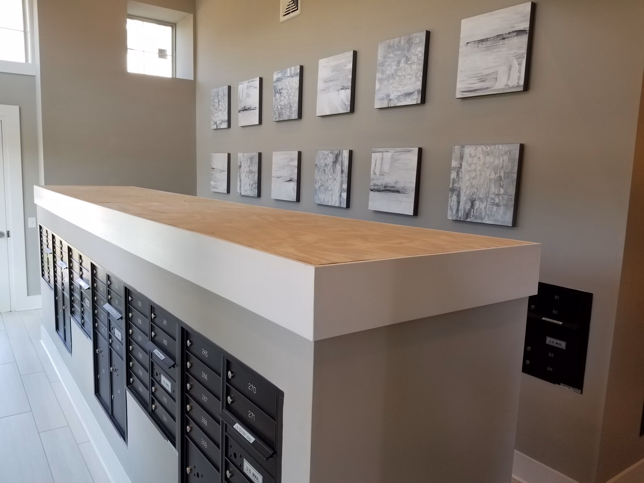 Clubhouse featuring modern design and cozy seating at The Peak at Nichols Plaza Apartments