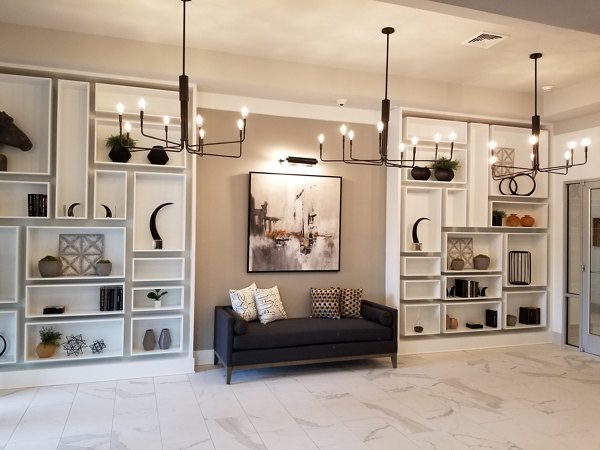 Luxury clubhouse with modern amenities at The Peak at Nichols Plaza Apartments, tailored for social gatherings and relaxation