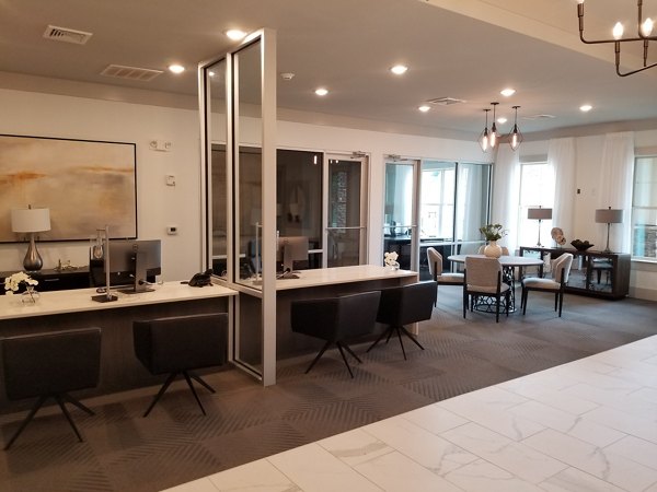 Stylish clubhouse with modern decor at The Peak at Nichols Plaza Apartments, perfect for gatherings and relaxation
