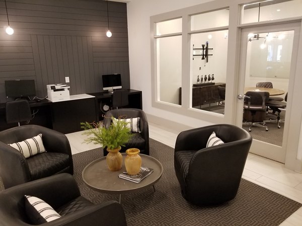 Luxurious clubhouse with modern furnishings at The Peak at Nichols Plaza Apartments