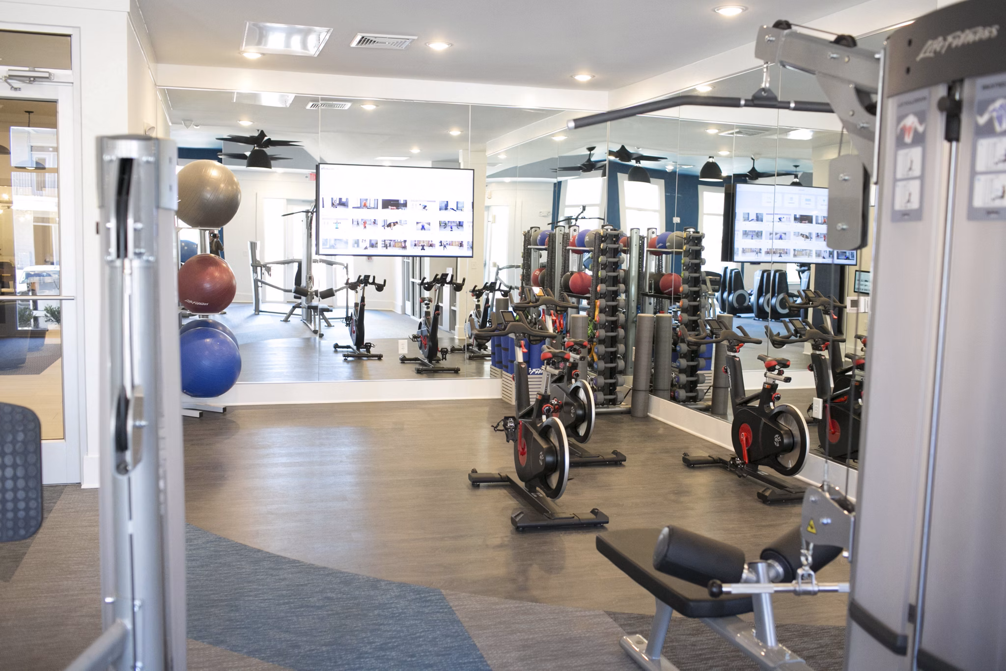 State-of-the-art fitness center with modern equipment at The Peak at Nichols Plaza Apartments