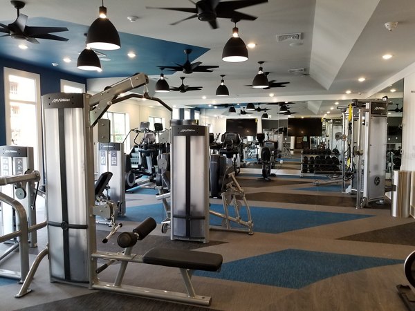 State-of-the-art fitness center with modern equipment at The Peak at Nichols Plaza Apartments