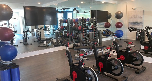 Modern fitness center with state-of-the-art equipment at The Peak at Nichols Plaza Apartments Perfect for maintaining an active lifestyle