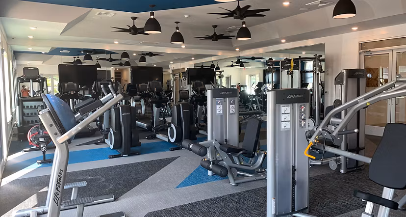 State-of-the-art fitness center with modern equipment at The Peak at Nichols Plaza Apartments Perfect for maintaining an active lifestyle