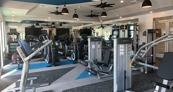 fitness center at The Peak at Nichols Plaza Apartments