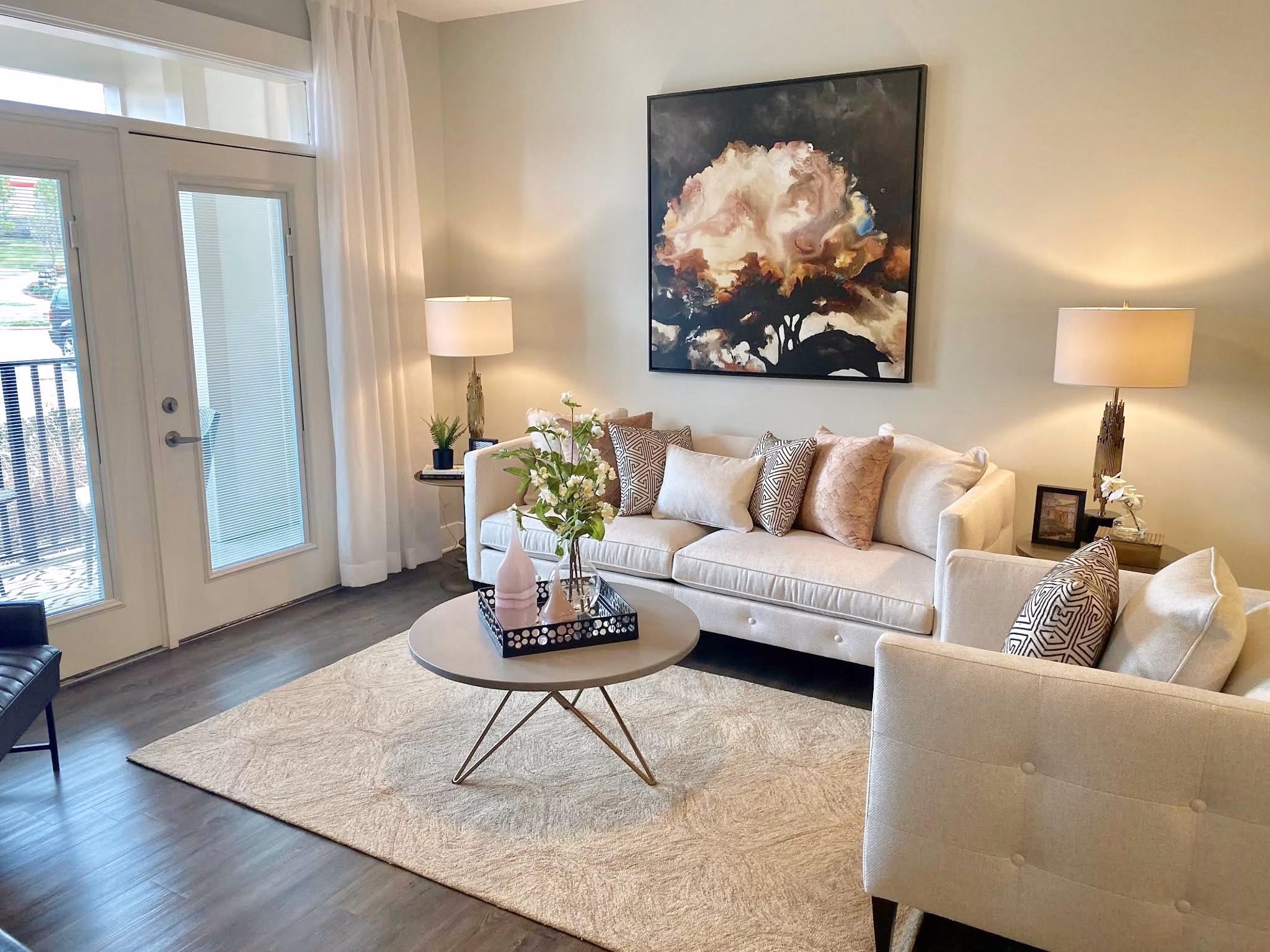 Contemporary living room with stylish furniture at The Peak at Nichols Plaza Apartments, showcasing upscale living in a prime location