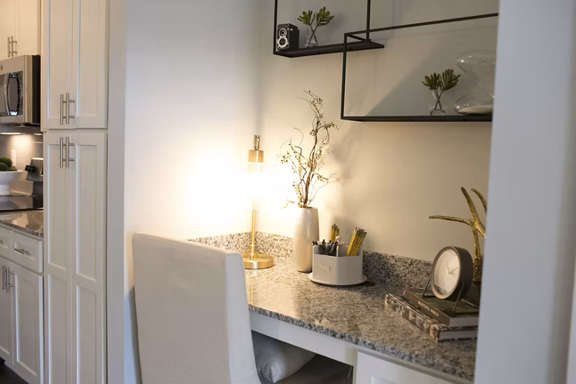 Spacious living room with modern decor in The Peak at Nichols Plaza Apartments