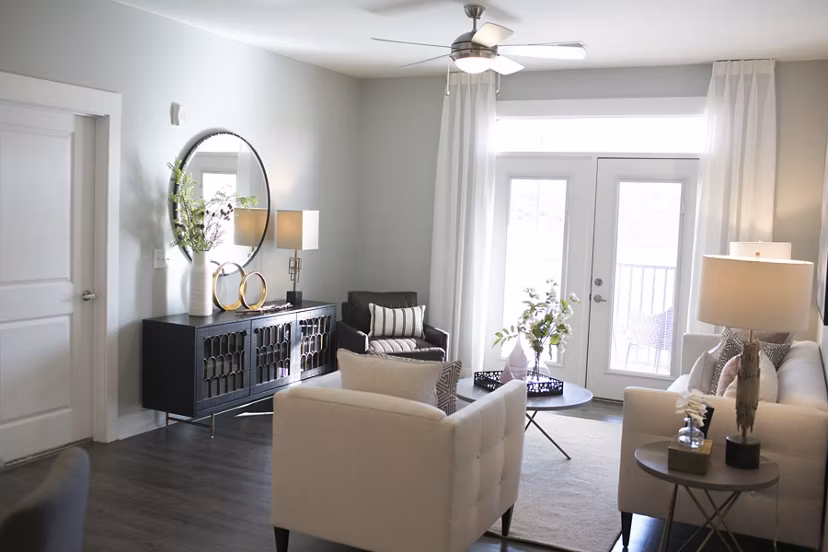 Spacious living room with modern furnishings at The Peak at Nichols Plaza Apartments
