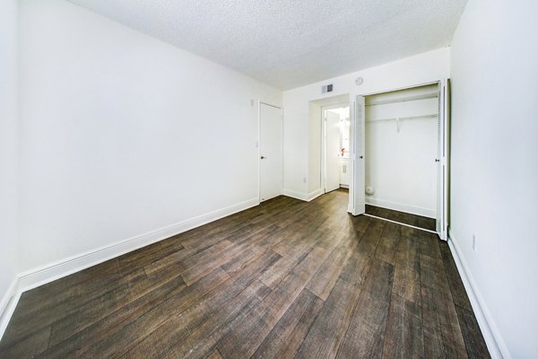 Modern bedroom with chic decor at 7 West Apartments, luxury high-rise living in prime location