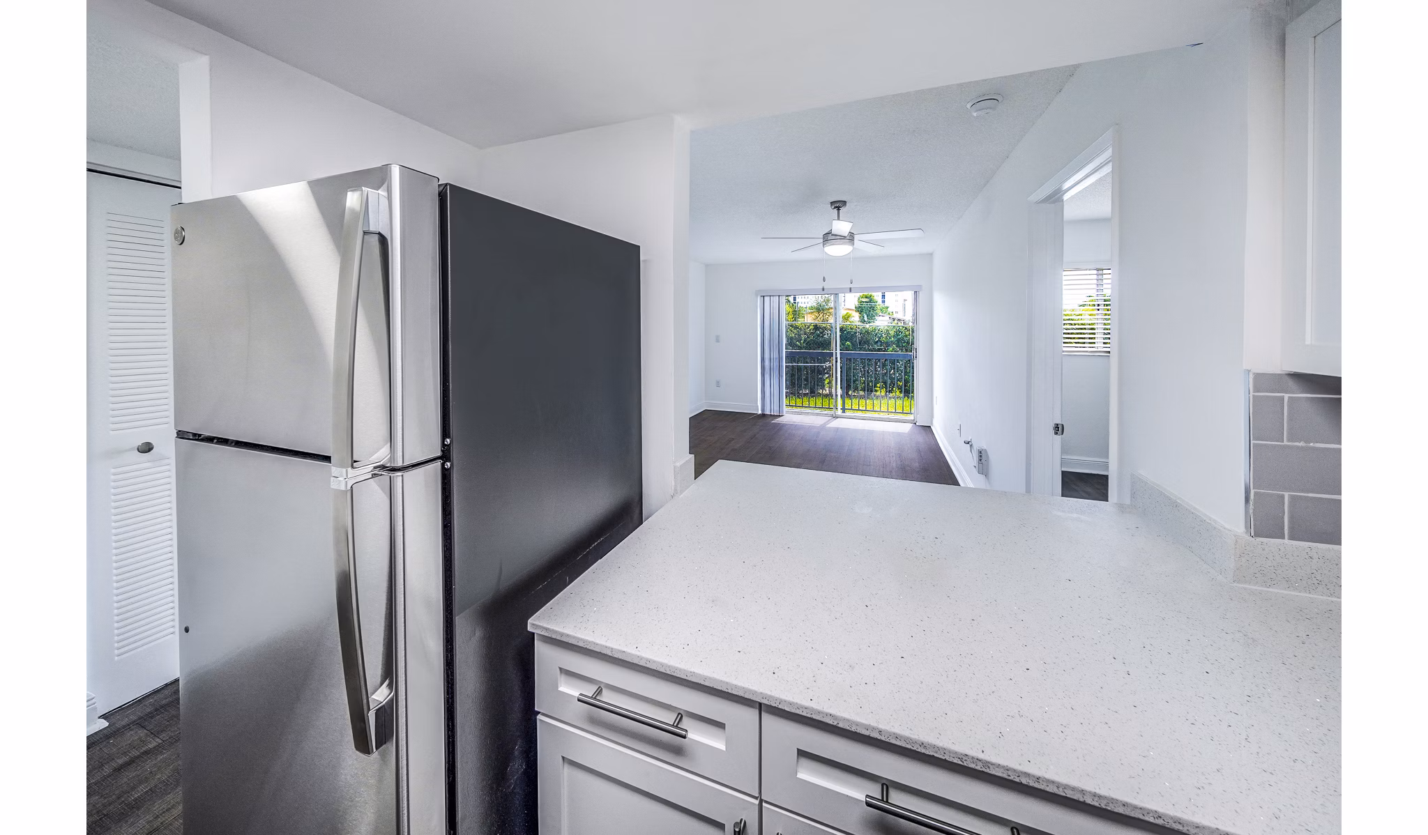 Modern kitchen with stainless steel appliances at 7 West Apartments, luxury living in an urban setting