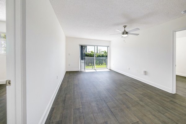 Elegant living room with modern decor and large windows at 7 West Apartments, offering luxury living in the heart of the city