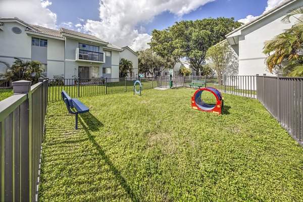 Dog-friendly area featuring a fenced dog park at 7 West Apartments, perfect for pet owners in a welcoming community