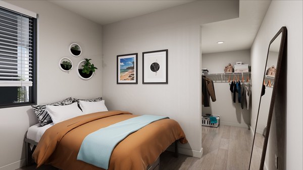 Union Grantville Apartments: Stylish bedroom with modern decor and ample natural light