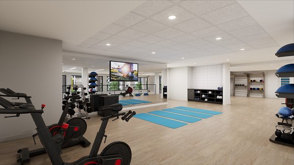 Modern fitness center with cardio machines at Union Grantville Apartments