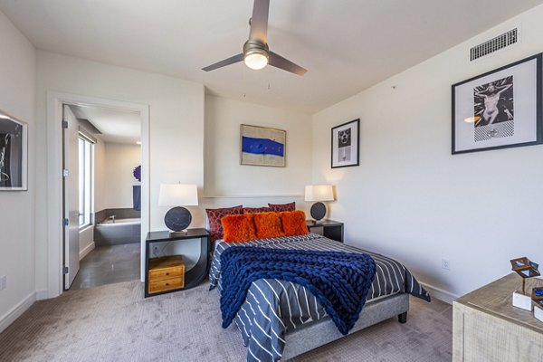Elegant bedroom with contemporary design at The Travis Apartments
