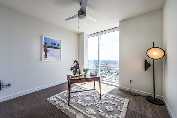The Travis Apartments: Cozy bedroom/home office with modern decor