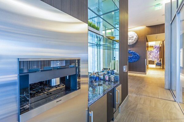 Clubhouse featuring modern design and seating areas at The Travis Apartments in Austin