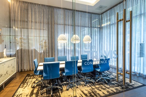 State-of-the-art meeting facility at The Travis Apartments featuring modern design and city views