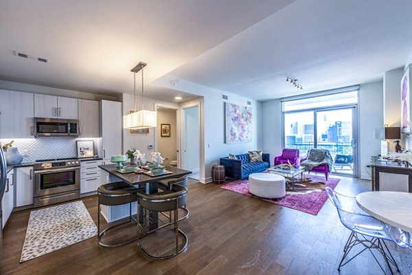Dining room featuring elegant dÃ©cor and modern furnishings at The Travis Apartments in Austin, Texas
