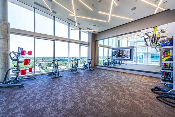 fitness center at The Travis Apartments