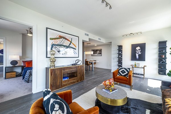Spacious living room with modern decor at The Travis Apartments in Austin, Texas