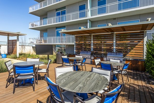 Outdoor grill area perfect for gatherings at The Travis Apartments luxury living community