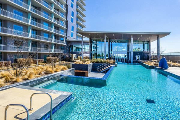 Luxurious pool area at The Travis Apartments offering a relaxing outdoor retreat in the heart of the city