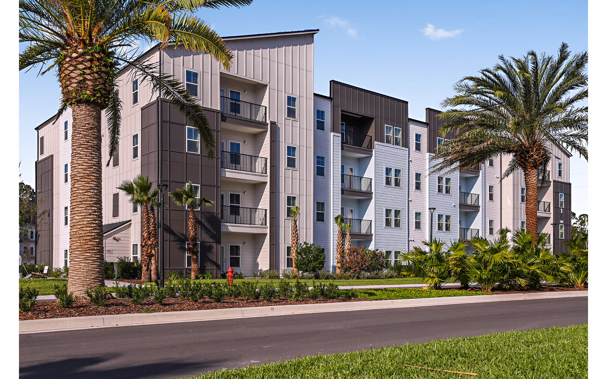 Grand Cypress Apartments: Luxury view of modern apartments in Wesley Chapel, highlighting elegant architectural design and scenic surroundings