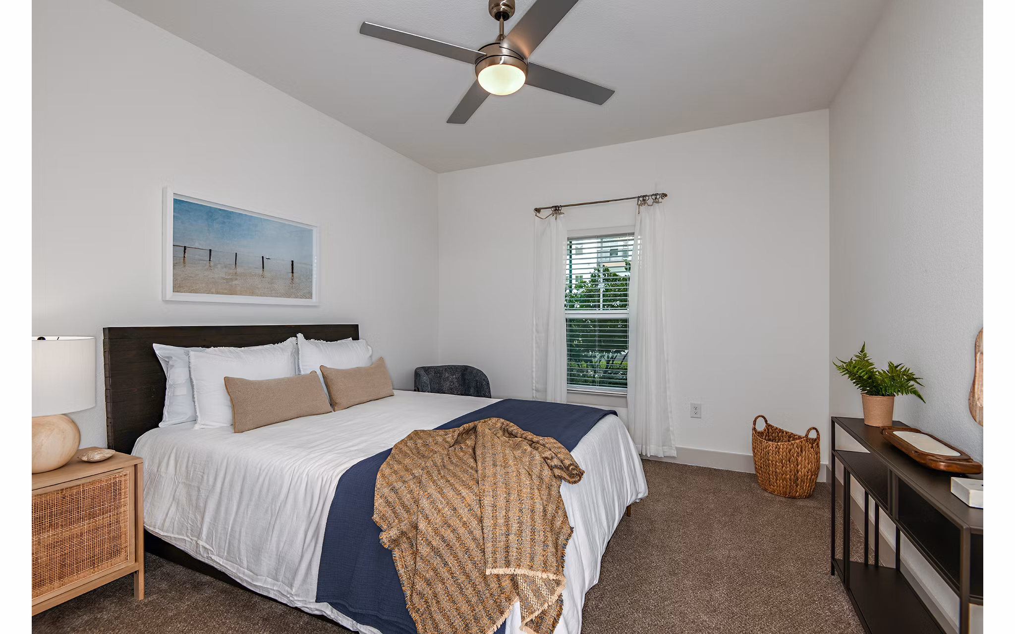 Bedroom with modern furnishings at Grand Cypress Apartments featuring luxury design